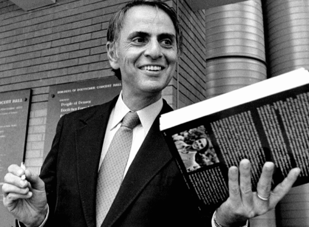 Sagan with his book, Cosmos, the book that brought the wonders of the universe to millions